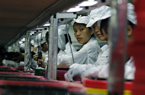 Workers are seen inside a Foxconn factory in the township of Longhua in the southern Guangdong province